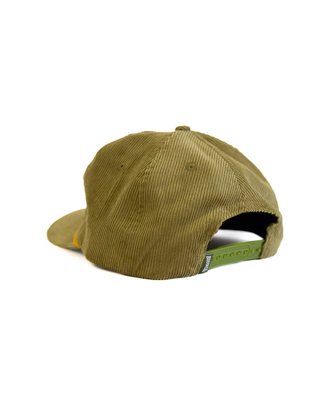 The Potato Patch Cord Snapback - Olive is an unstructured 5-panel hat in olive green, shown from the back with a green snapback closure and a black and white tag on the adjustable strap, set against a white background.