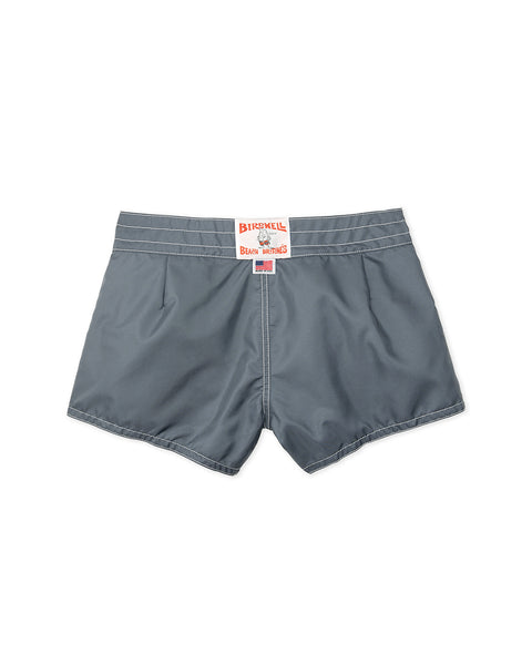 The Women's 400 Boardshorts in Slate are shown from the back, featuring white stitching and a red and white Birdwell Beach Britches patch on the waistband. Made with quick-drying fabric for all-day comfort.