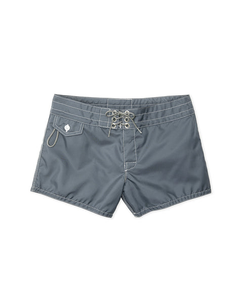 Women's 400 Boardshorts in Slate feature white stitching, quick-drying fabric, a lace-up front, right-side flap pocket with button, and a metal key loop above the pocket. The shorts are shown laid flat on a white background.