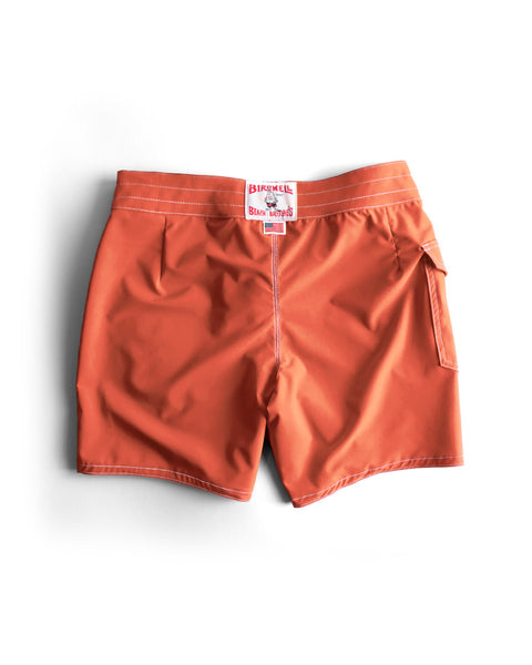 808 SurfStretch Side Pocket Boardshorts in Paprika, featuring white stitching, a small side pocket, and a Birnell brand label attached to the waistband, displayed on a white background. Inspired by classic boardshort design and proudly made in the USA.