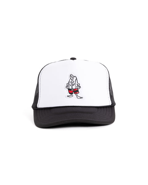 The Birdie Trucker - Black/White is a 5-panel structured foam trucker hat with a cartoon surfboard in red shorts on the white front, plus black back and brim for a classic look.