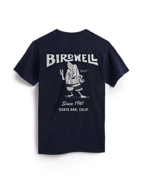 The 61 T-Shirt - Navy/White is a navy blue garment-dyed cotton tee featuring retro cartoon Birdie in board shorts on the back. White 