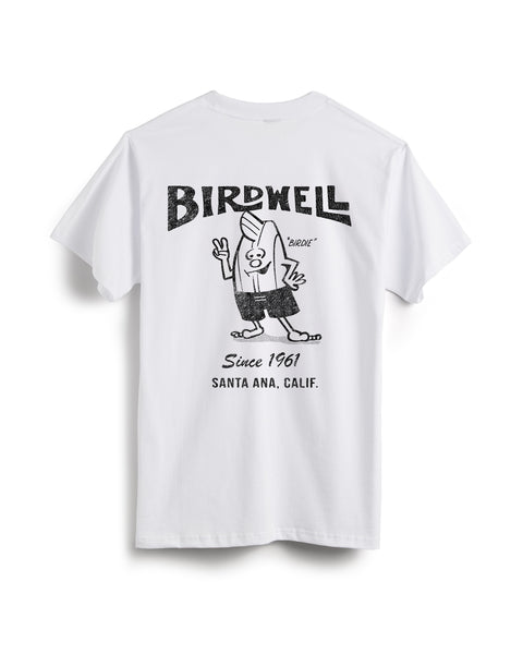 The 61 T-Shirt - White/Black is a heavyweight white tee made from 100% cotton, featuring a cartoon surfboard character, peace sign hand, and BIRDWELL graphics with 