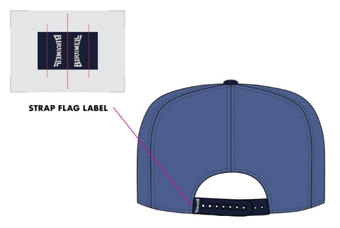Illustration of the Trademark Hemp Snapback - Federal Blue/Navy, viewed from the back. Shows a close-up of the adjustable strap with a small navy label reading BIRDWELL in white text, with label placement highlighted by a callout.