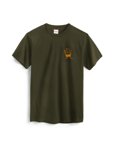 The Custom T-Shirt - Surplus Green is a garment-dyed cotton tee in olive green, featuring a small yellow cartoon character graphic on the left chest, shown against a white background.