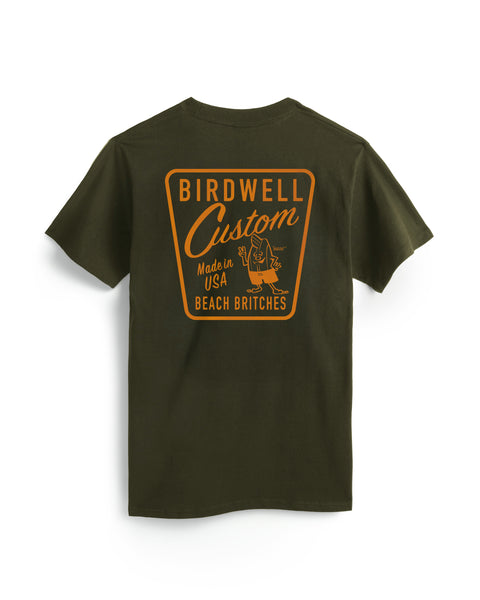 The Custom T-Shirt - Surplus Green is a dark green heavyweight cotton tee featuring a large orange and yellow 