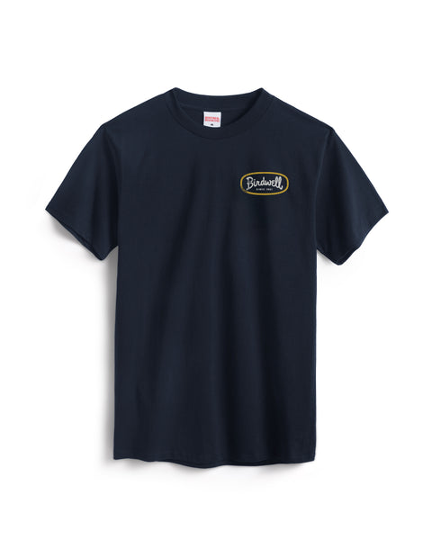 A navy cotton heavyweight Potato T-Shirt with a small yellow and white logo on the left chest, shown against a white background.