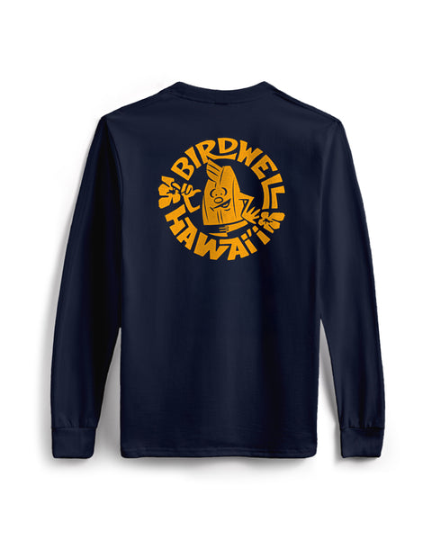 The Shaka Long Sleeve Pocket T-Shirt - Navy is a navy blue cotton shirt made in the USA, with a large yellow cartoon bird holding a surfboard and 