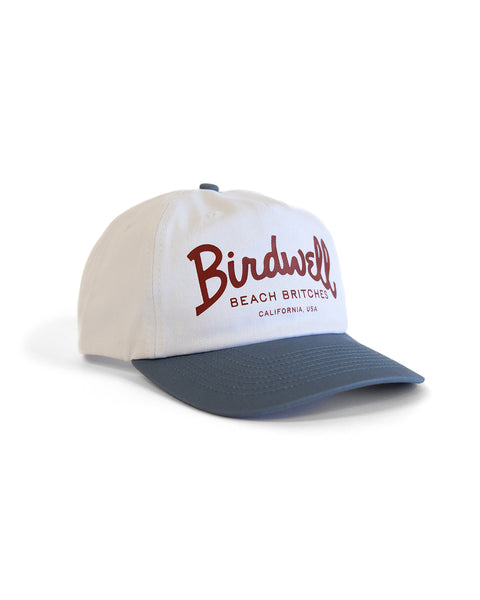 The Big Arc Twill Snapback - White/Federal Blue is a white 5-panel unstructured cotton snapback hat with a blue brim and 
