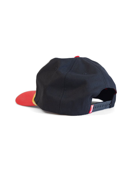 The Potato Patch Twill Snapback in bone, red, and black is shown from the back with an adjustable snap closure and a slightly curved brim, set against a white background.