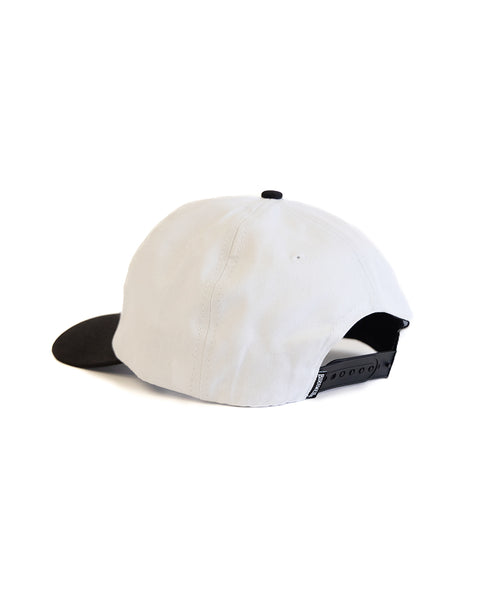 The Big Arc Twill Snapback - White/Black is a white cotton hat with a black curved brim and black adjustable snapback closure, displayed from the back on a white background.