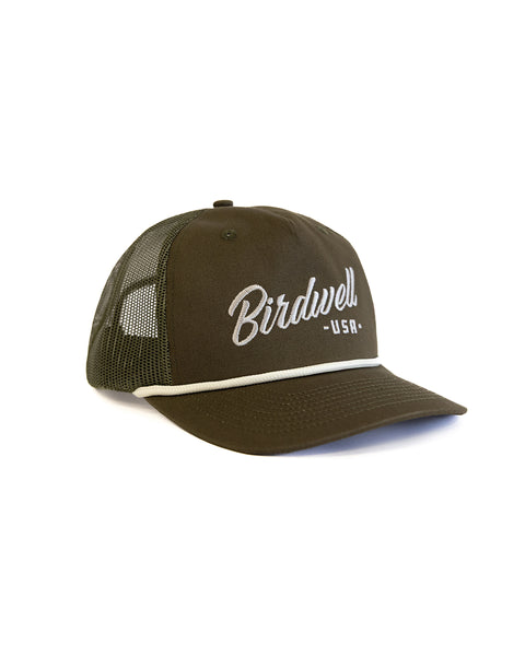 The Script Twill Trucker - Olive/Bone is a green 5-panel mesh hat featuring a curved brim and 