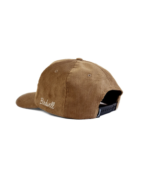 The Big B Cord Snapback - Brown is a brown corduroy 5-panel hat with an adjustable black snap closure and 