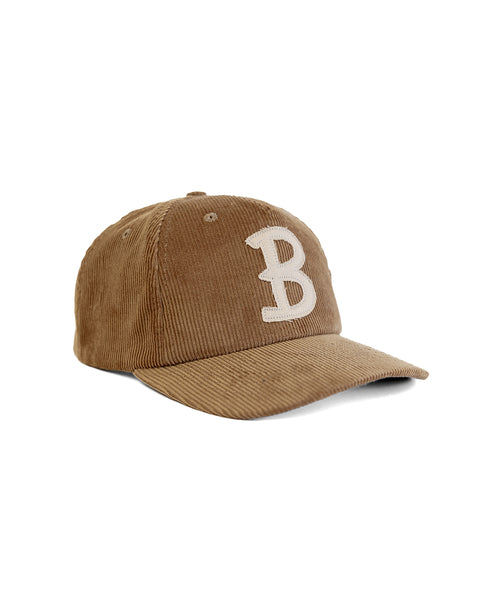The Big B Cord Snapback - Brown is a 5 panel hat featuring brown corduroy and a white embroidered letter B on the front, shown against a plain white background.