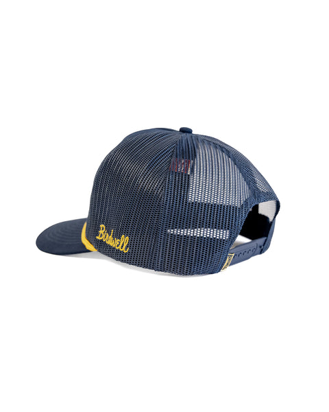 The Big Birdie Twill Trucker - Navy is a navy mesh 5-panel cotton twill trucker hat with a high crown, snapback closure, yellow accents, and 