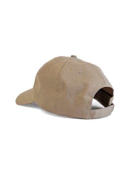 The Daddy Twill Hat in sand, made of cotton, is shown from the back with an adjustable snapbuckle closure and a curved brim against a white background.