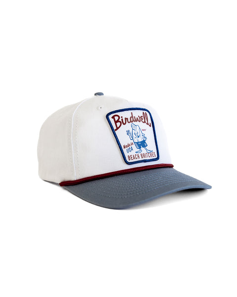 The Milkman Twill Snapback - White/Federal Blue is a white and gray 5-panel hat with a blue and red 