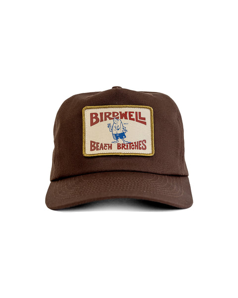 The OG Twill Snapback - Brown is a cotton snapback hat featuring a rectangular front patch with 