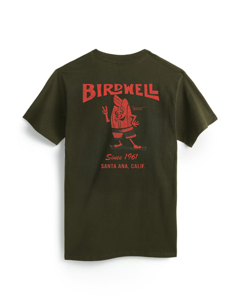 The 61 T-Shirt - Surplus Green is a dark green, garment-dyed cotton tee with a red BIRDWELL graphic, 