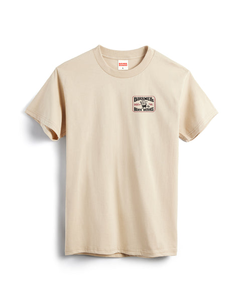 The Hangtag T-Shirt - Cream is a heavyweight, 100% cotton beige tee with a small rectangular BIKEHELL patch above crossed handlebars and Biker Bones below on the left chest, shown laid flat on a white background.
