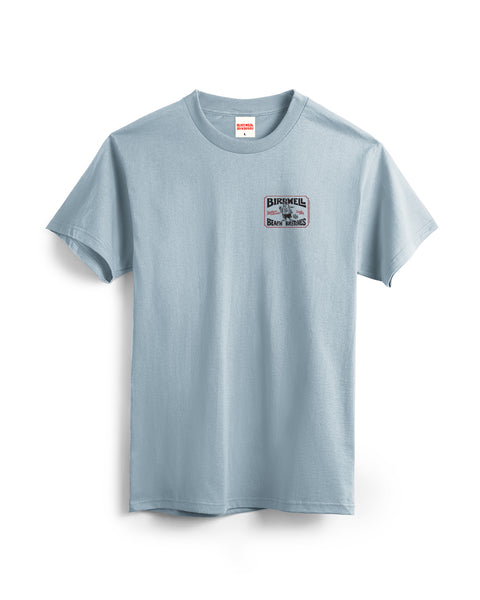 The Hangtag T-Shirt – Arctic Blue is a heavyweight cotton tee, garment-dyed for softness, with a small BIRDSHELL graphic and text on the left chest; shown on white. Inspired by Birdwell’s classic style.