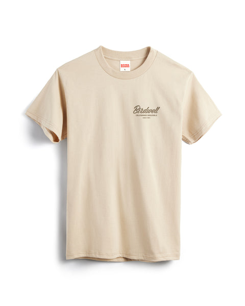The Daydreamin Birdie T-Shirt - Cream is a heavyweight, garment-dyed cotton tee with 