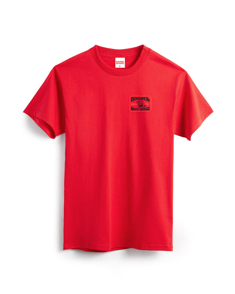 The Hangtag T-Shirt - Fuji Red is a heavyweight, plain red cotton tee featuring a small black and red BIRNHIEL logo and text on the left chest. Inspired by Birdwell, this garment-dyed shirt is shown on a white background.