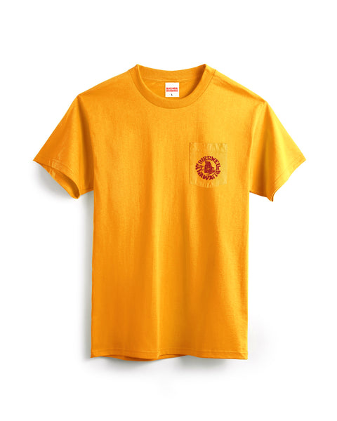The Shaka Pocket T-Shirt - Gold is a heavyweight cotton tee made in the USA, featuring a chest pocket with a circular red graphic and text, shown against a white background.