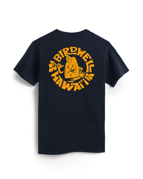The Shaka Pocket T-Shirt - Navy is a heavyweight, USA-made cotton tee with a front pocket and a bold yellow graphic on the back of Birdwell Hawaii and a smiling tiki holding a surfboard.