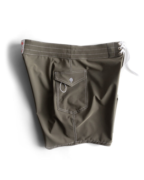 808 SurfStretch Side Pocket Boardshorts - Army in olive green, featuring white stitching, a side buttoned flap pocket, and a white drawstring waist, shown against a white background.