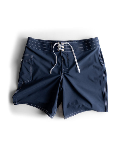 808 SurfStretch Side Pocket Boardshorts in navy, featuring white stitching, a lace-up front, and a side pocket, laid flat on a white background.