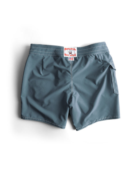 The 806 SurfStretch Side Pocket Boardshorts in Federal Blue feature white stitching, a right back pocket, and a white label with red text by the waistband. Shown laid flat on a white background.