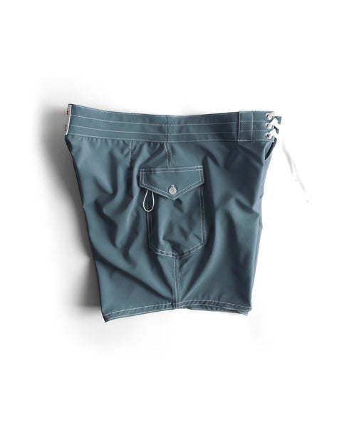 The 806 SurfStretch Side Pocket Boardshorts in Federal Blue feature white stitching, a button-flap back pocket with metal grommet, a side pocket, and a white drawstring waistband.