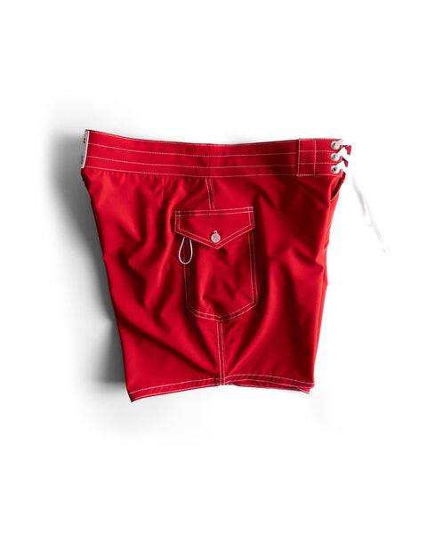 806 SurfStretch Side Pocket Boardshorts in red feature white stitching, a flap front pocket with button, small metal ring, and white lace ties at the waistband. Made in USA. Shown on a white background.