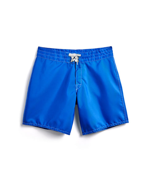 300 Boardshorts in royal blue with white stitching and a white drawstring, made in the USA, shown flat on a white background.