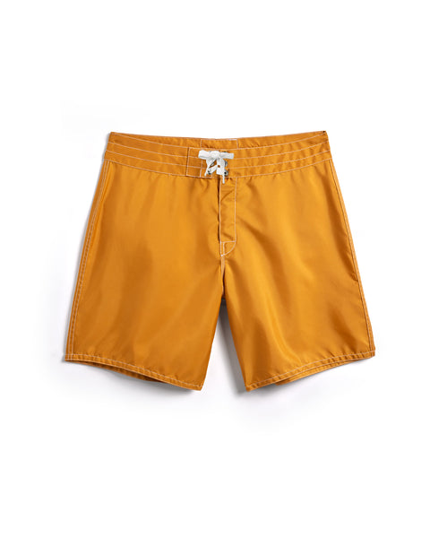 A pair of 300 Boardshorts - Gold with a white drawstring at the waist, laid flat on a white background.