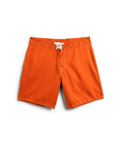 The 300 Boardshorts in Medium Orange feature a white drawstring waist, stitched details, and a classic design, shown laid flat on a white background.