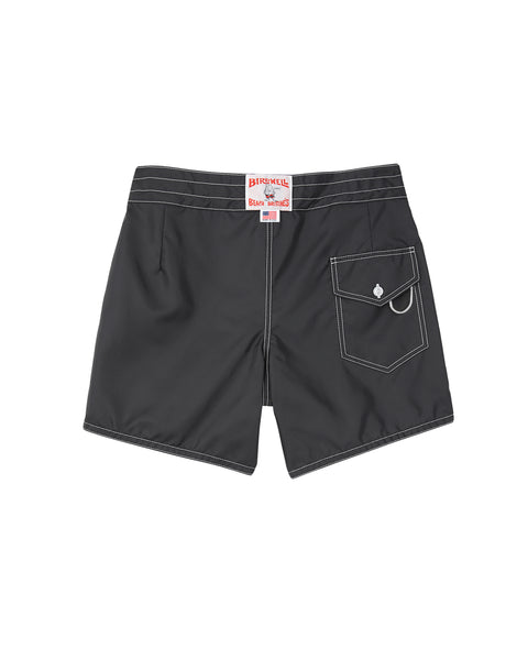 The Birdwell Beach Britches 310 Boardshorts in black feature white stitching, a back pocket with a flap and button, and a red and white label above the waistband.