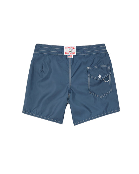 The 310 Boardshorts - Navy are shown from the back with white stitching, a button-flap back pocket and loop, a waistband label, and are made from durable SurfNyl fabric for lasting wear.