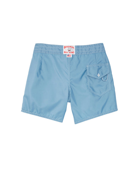 Federal Blue 310 Boardshorts by Birdwell, featuring an elastic waistband, rear flap pocket with button closure and key loop, plus a red and white back label. Classic SurfNyl shorts shown laid flat from the back.