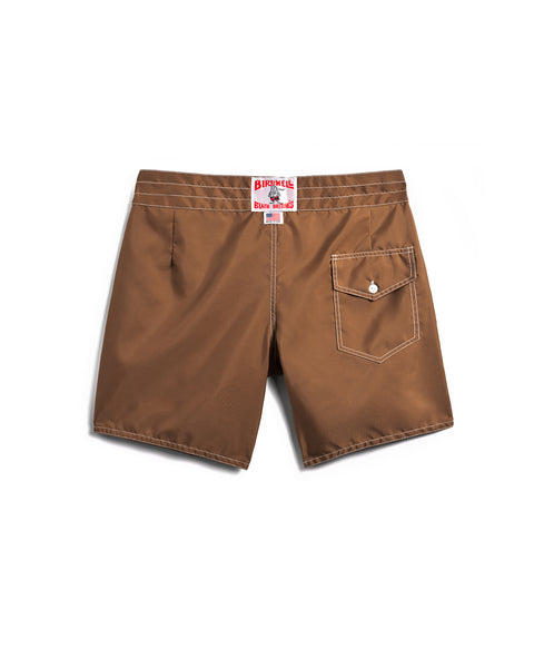 310 Boardshorts - Tobacco shown flat on a white background, back side up. Features white stitching, a single button-flap back pocket, and a red and white SurfNyl label above the waistband.