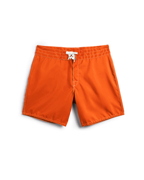 The 310 Boardshorts in Medium Orange feature a white drawstring and visible stitching at the waistband and leg openings, shown against a plain white background.