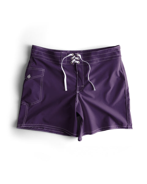 806 SurfStretch Side Pocket Boardshorts in purple, featuring white stitching, front lace-up closure, and a button-flap side pocket, displayed flat on a white background.
