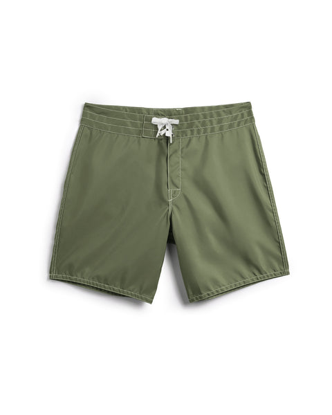 The 300 Boardshorts - Olive are mid-thigh, olive green SurfNyl boardshorts with a white waist drawstring, featuring a simple design and made in the USA. Shown laid flat on a white background.