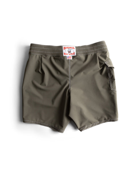 Army green 808 SurfStretch Side Pocket Boardshorts with white stitching, one side pocket, and a red-and-white Birdwell patch on the waistband. Made in USA and shown flat on a white background.