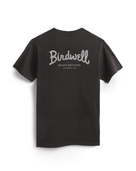 The Script Pocket T-Shirt - Vintage Black is a heavyweight, short-sleeve tee made in the USA with “Birdwell Beach Britches California, USA” in bold light lettering across the upper back.