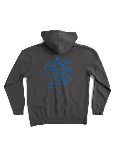 The Bros Midweight Hoodie - Faded Black is a relaxed fit, dark gray pigment-dyed hoodie with a blue screen-print graphic of a surfer riding a wave on the back. Hood up, it’s displayed flat on a white background.