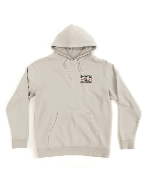 The Hangtag Midweight Hoodie - Bone is a light gray relaxed fit hoodie with a front pocket, drawstrings, and a small Batshell Brew House logo patch on the upper left chest. The product is displayed against a white background.