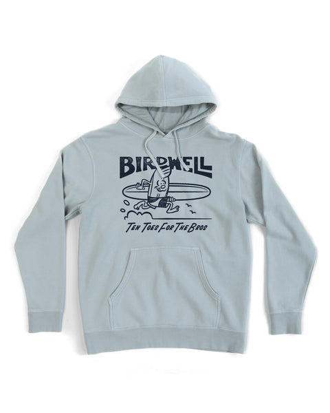 The B-Line Midweight Hoodie - Sage is a light gray relaxed fit hoodie with a surfing bird graphic, 