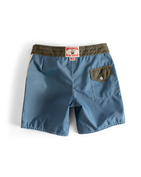 The 300 Legend boardshorts in Federal Blue with a dark olive waistband and bone details feature a single buttoned back pocket, signature red and white 